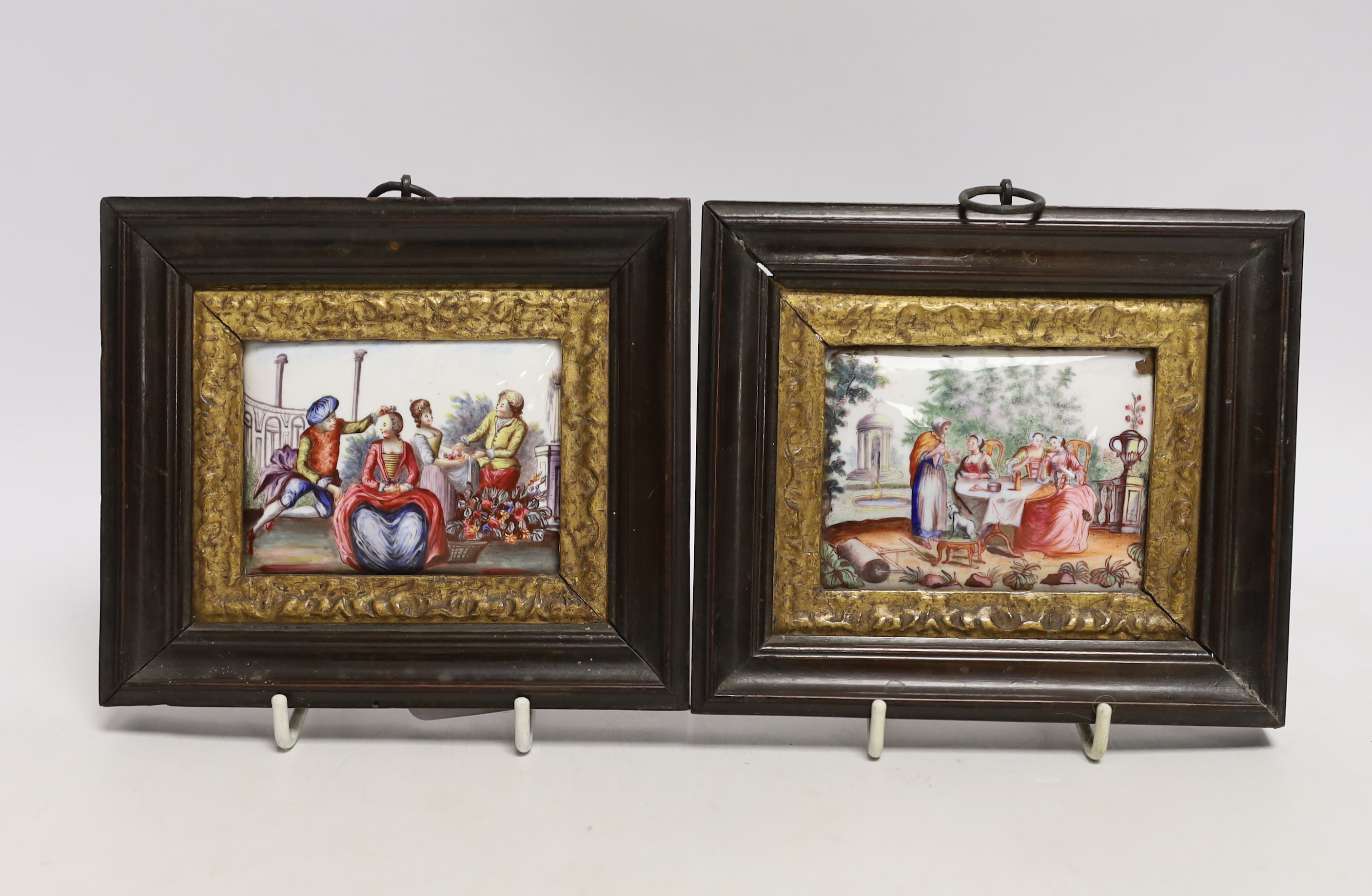 A framed pair of 18th century French enamel on copper plaques, 12x15cm total